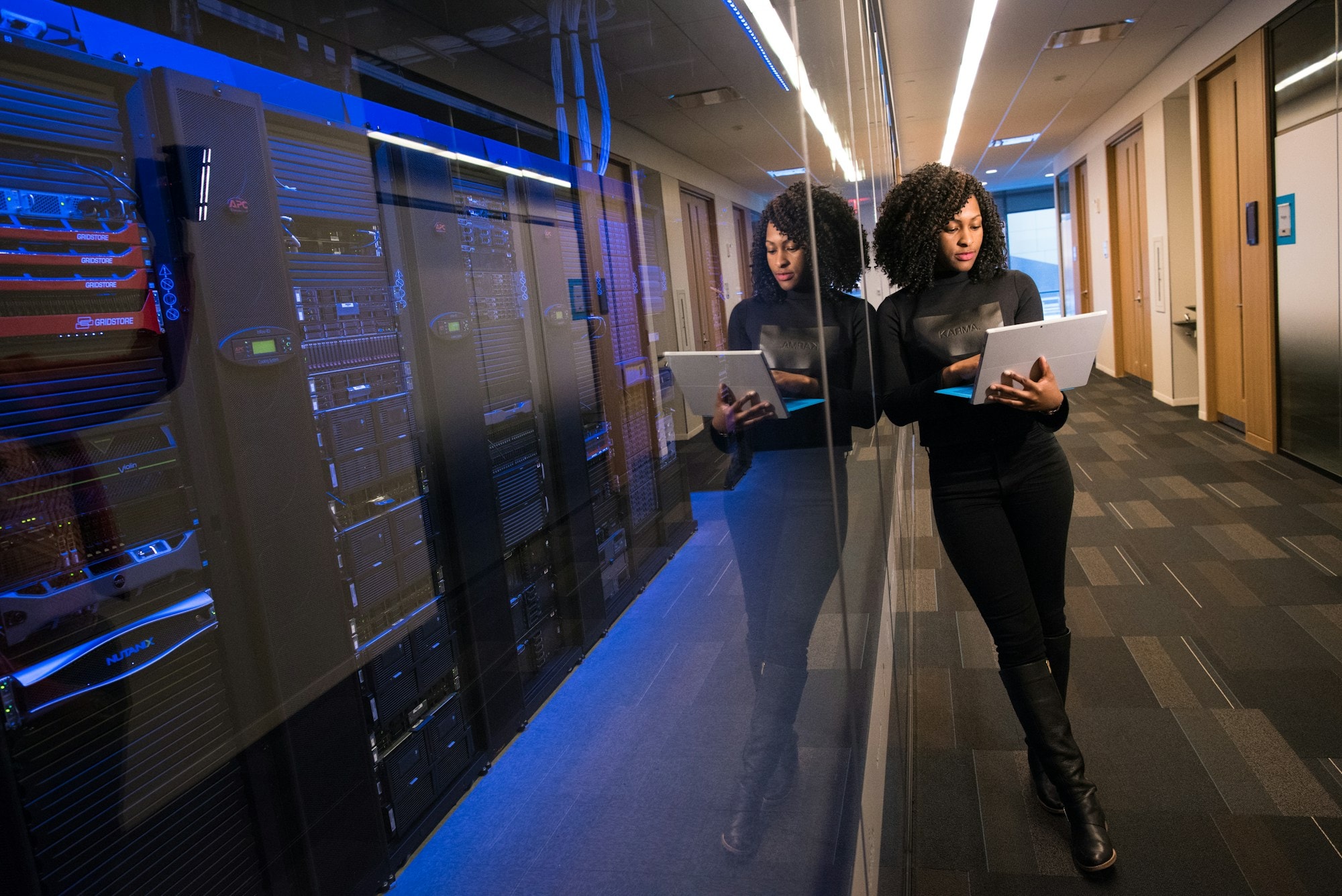 IT professionals reviewing systems in a server room