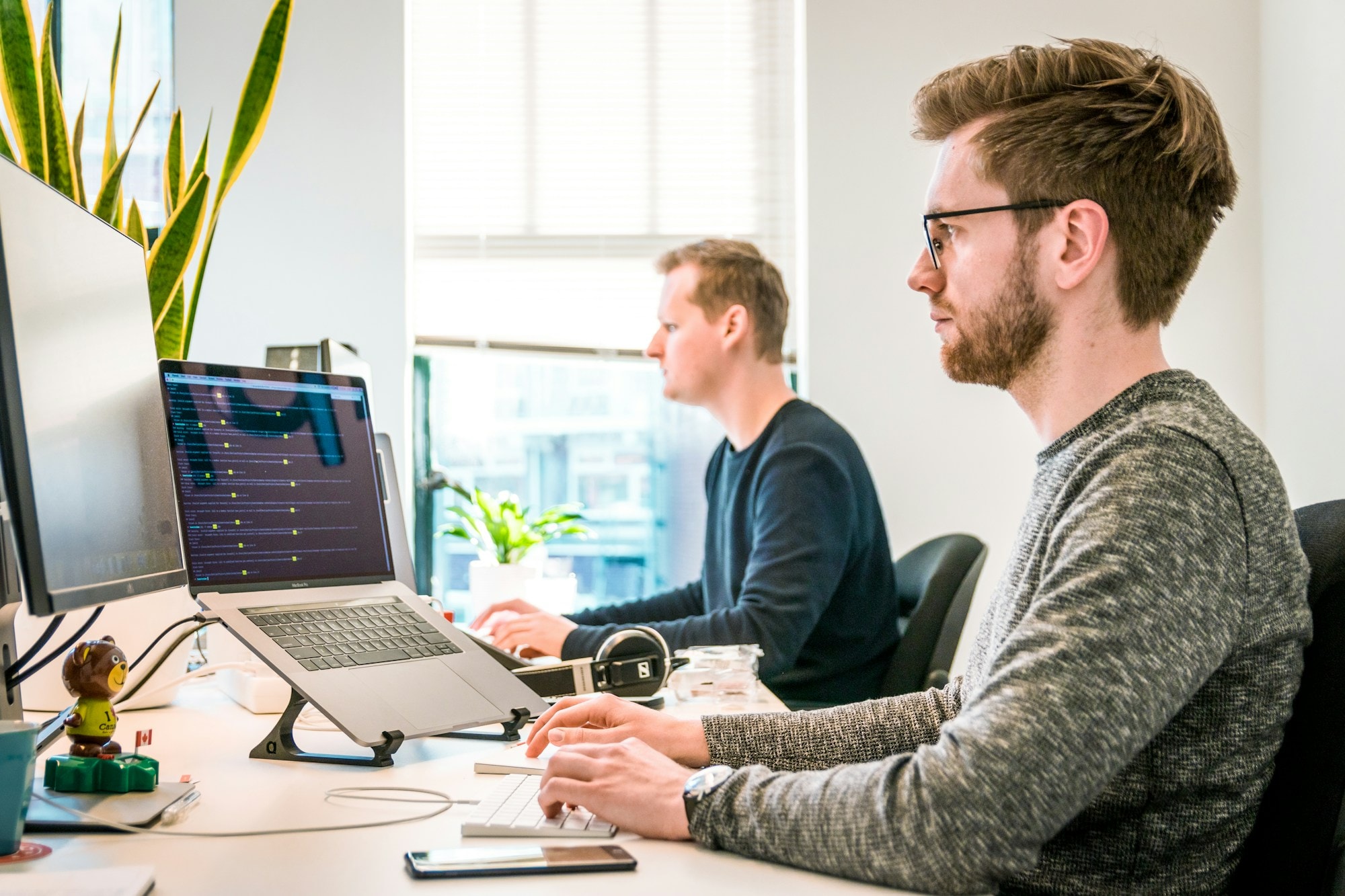 IT team working together at their workstations